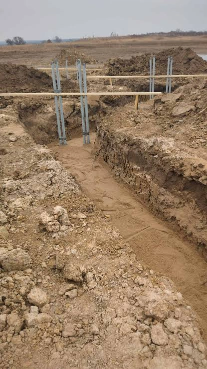 Excavator machine preparing land